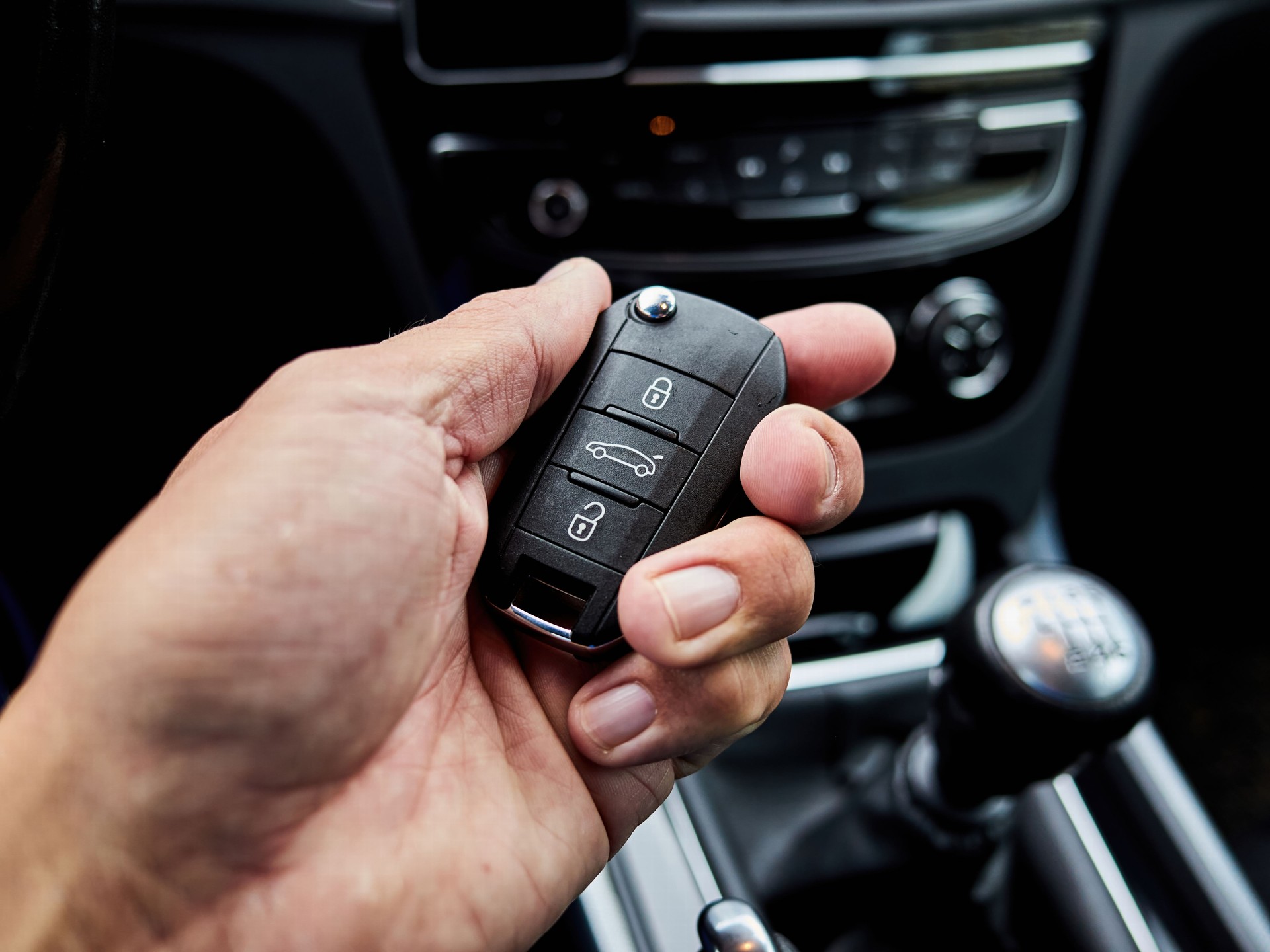 Man is holding a key in his hand